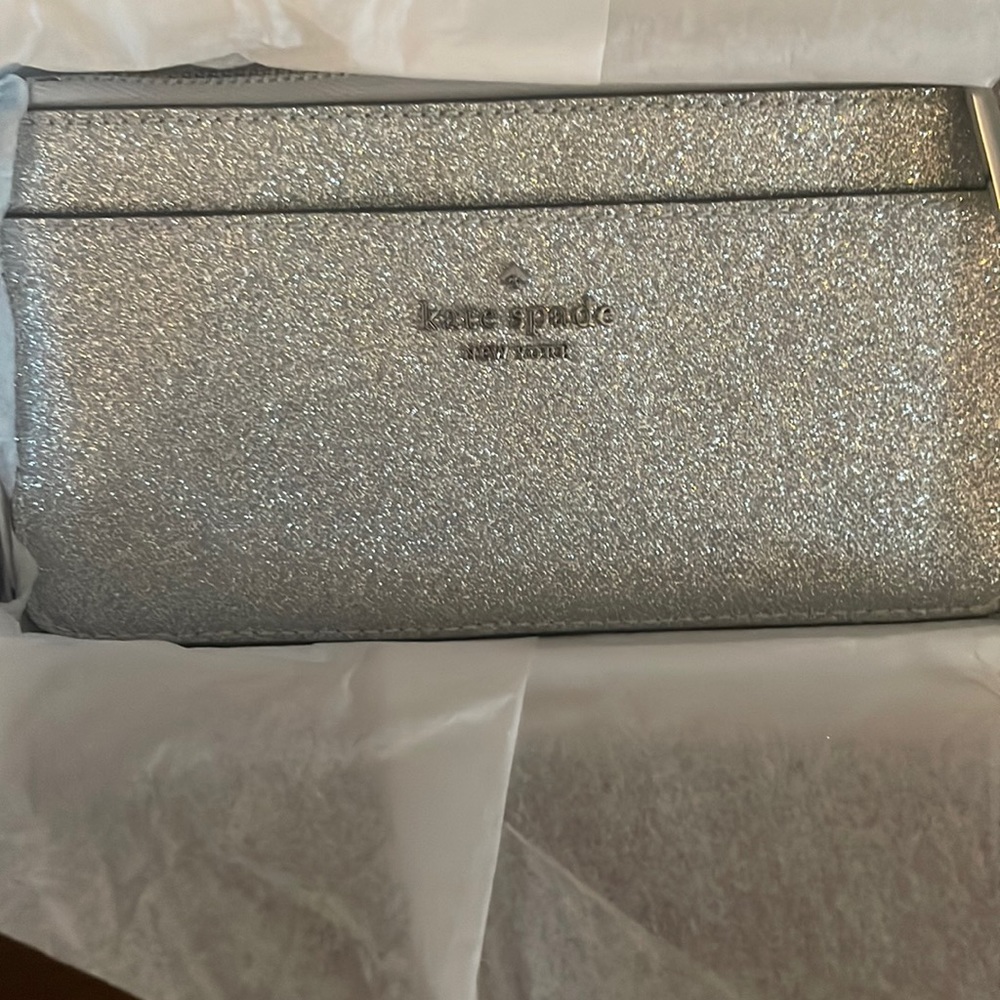 Kate Spade boxed large slim cardholder lunar light. Glittery